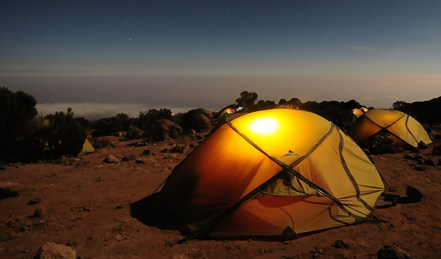 camp at night in the middle of the desert